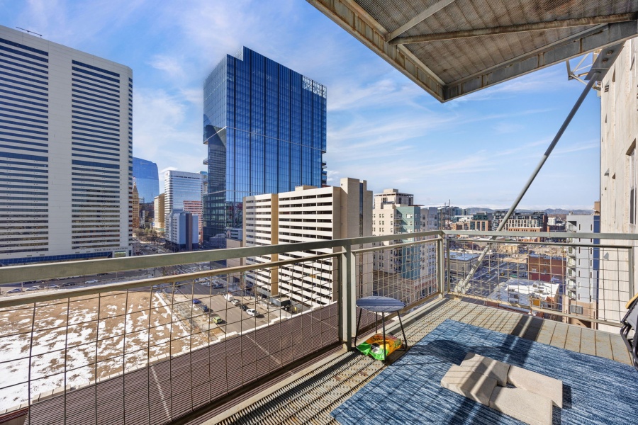 This fully furnished 1 bedroom, 1.5 bathroom condo is located in the sought-after Arapahoe SkyLofts, right in the heart of Denver. Offering 1,124 square feet of thoughtfully designed living space, this home blends modern loft-style character with comfort and convenience.
 
The condo features hardwood floors, concrete walls, and exposed ductwork, creating a clean, contemporary industrial aesthetic. The open living area flows seamlessly into the dining space, which includes seating for four, plus two bar stools at the kitchen counter, making it ideal for entertaining or casual meals.
 
The spacious primary bedroom is furnished with a king bed and provides a quiet retreat. The primary bathroom includes a tub/shower combination, while a convenient half-bath powder room is located off the main living area—perfect for guests. An in-unit washer and dryer adds everyday convenience.
 
Step out onto the private balcony and enjoy views of downtown Denver, a perfect spot for morning coffee or evening relaxation.
 
Parking is a rare downtown luxury, and this unit includes two parking spaces in the attached garage—one suitable for a compact vehicle and the other for a full-size car.
 
Built in 1983, Arapahoe SkyLofts is ideally situated near Union Station and Coors Field, with easy access to downtown office buildings, public transportation, and major roadways. The neighborhood offers an abundance of restaurants, coffee shops, and retail options, all within close proximity.
 
This fully furnished condo provides an exceptional opportunity to enjoy urban living with space, style, and convenience in one of Denver’s most vibrant locations.