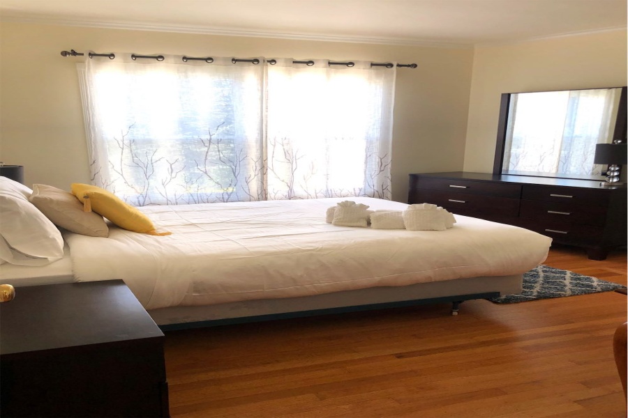 3 Bedroom/2 Bathroom mid-century single family house is located in Noe Valley. Features: desk, original chandelier, original art-deco lines in the crown molding trims and arched doorways, bathtub features extra length (for bath soaks), deep closets, downtown skyline views, original kitchen tiling and cabinets, portable dishwasher, and a large bonus room. The King bed in the lower bedroom can be separated into two twin beds. The house has a deep 2-car attached garage that will fit 2 smaller vehicles with tandem parking.  Washer and dryer are in the garage.  This pet-friendly property also has a quaint zen garden like backyard area that is totally fenced in.

Easy access to commuter shuttles and public transportation. Near the 24th Street commercial corridor and a small climb to the Diamond Heights shopping center for a variety of shops to include Safeway, Walgreens and a Chinese dim sum restaurant.

 

 